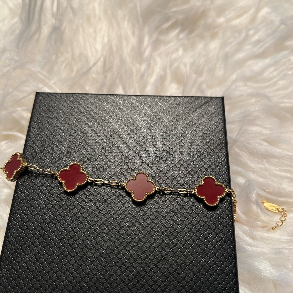 Elegant Gold and Red Clover Bracelet